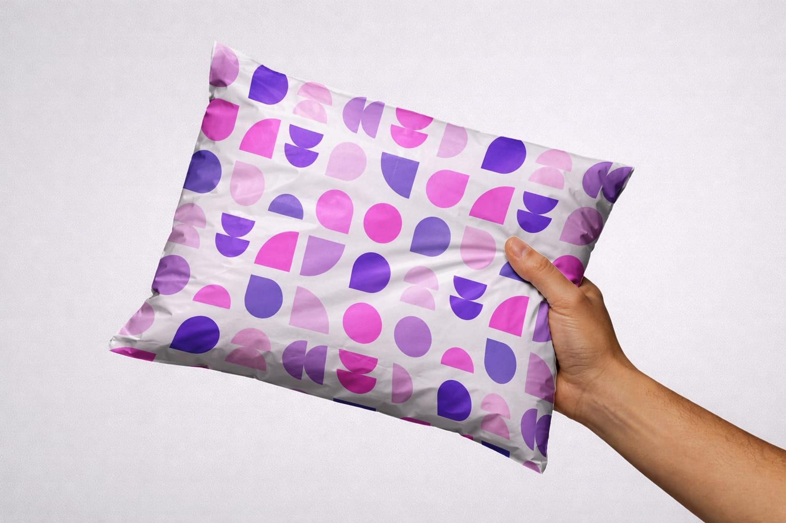 Hand Holding Pillow Mockup