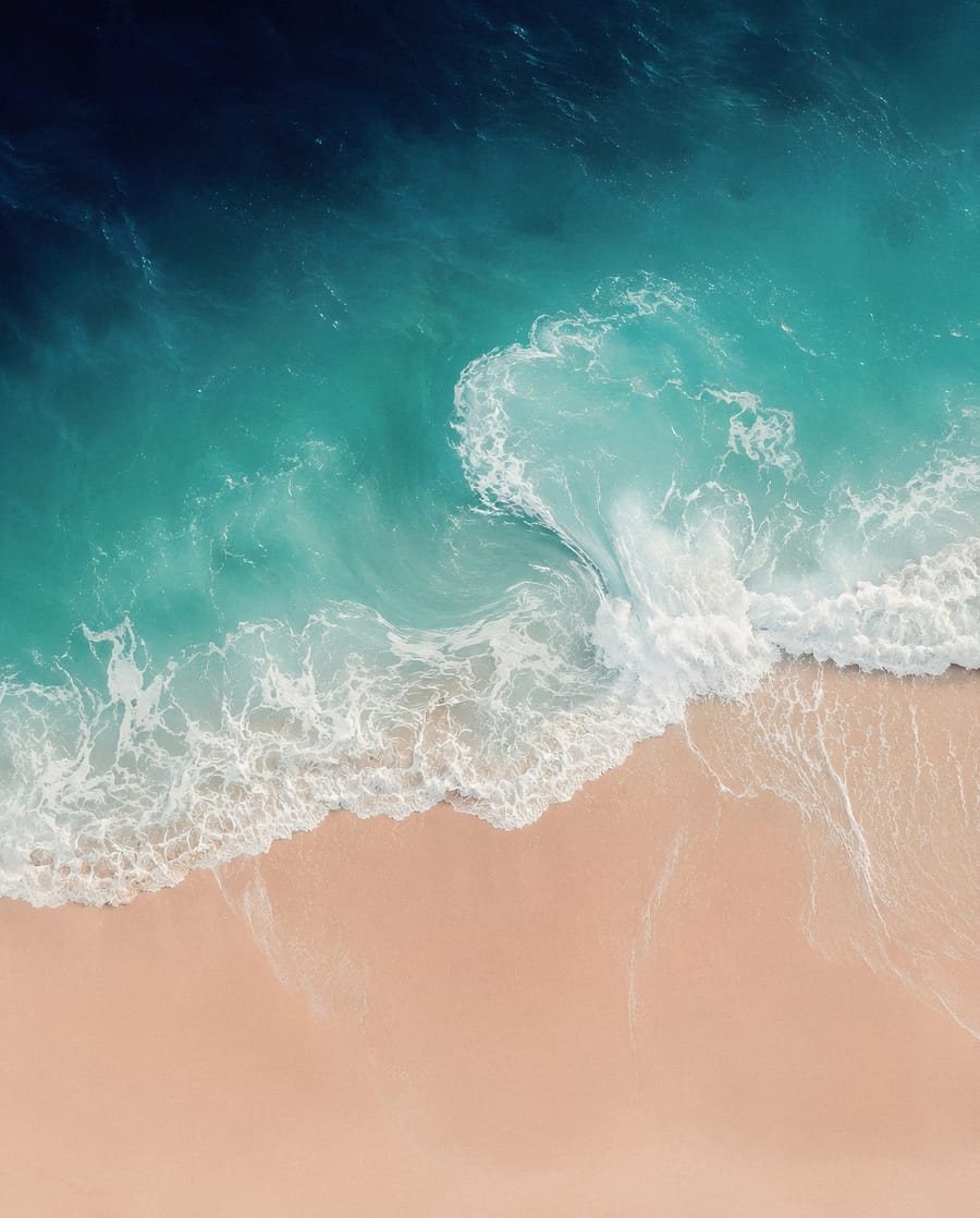 Serene Turquoise Waves On Sandy Beach